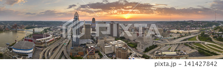 Cincinnati Ohio USA sunset urban landscape. Downtown district skyline with brightly illuminated high skyscraper buildings in modern American megapolis Cincinnati Ohio USA sunset urban landscape. Downtown district skyline with brightly illuminated high skyscraper buildings in modern American megapolis 141427842