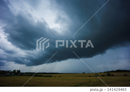 Angry supercell storm influenced by Climate change. Dangerous storm supercell shelf cloud with layers 141429465