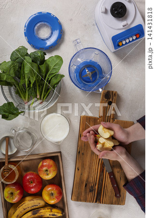 Preparing fresh apple spinach smoothie ingredients Preparing fresh apple spinach smoothie ingredients 141431818