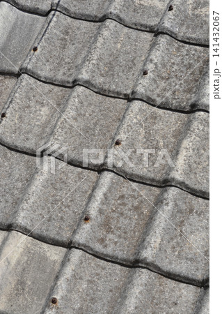 Old weathered concrete roof tiles background Old weathered concrete roof tiles background 141432067
