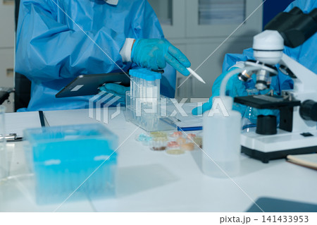 Microbiologists and nutrition experts analyze molecular samples in advanced food science labs, exploring innovations in nutrition, psychiatry, and health science research. Microbiologists and nutrition experts analyze molecular samples in advanced food science labs, exploring innovations in nutrition, psychiatry, and health science research. 141433953