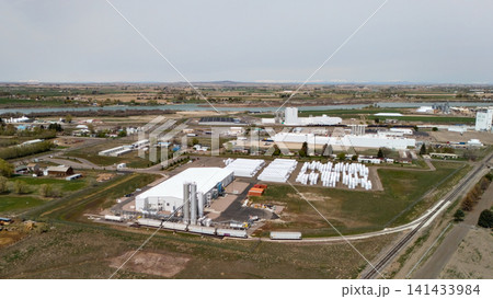 Drone View Of Manufacturing Plant Surrounded By Farmland And Fields 141433984