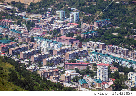View from above showing a Kajaran city nestled among steep hills and trees View from above showing a Kajaran city nestled among steep hills and trees 141436857