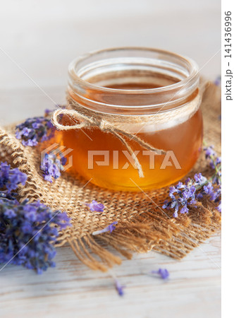 Honey jar with lavender flowers rustic healing concept 141436996