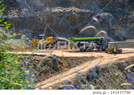 Excavation site with heavy equipment Excavation site with heavy equipment 141437796