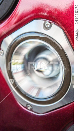 Automotive sound system speaker detail, vibrant red car interior panel, modern audio equipment installation, custom vehicle tuning component close-up, high fidelity sound reproduction. Automotive sound system speaker detail, vibrant red car interior panel, modern audio equipment installation, custom vehicle tuning component close-up, high fidelity sound reproduction. 141438170
