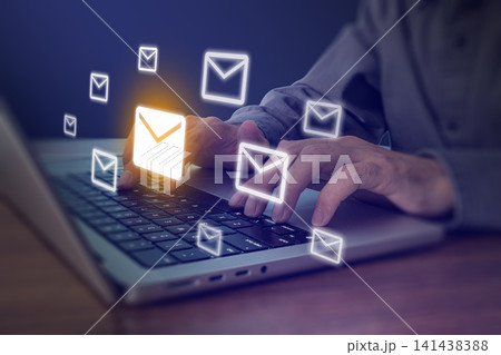 Person typing on laptop with glowing email envelope icons flying, digital communication and email marketing concept Person typing on laptop with glowing email envelope icons flying, digital communication and email marketing concept 141438388