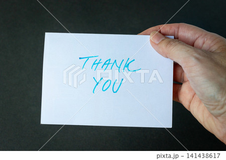 Hand holding a thank you card 141438617