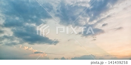 Golden light piercing through thick clouds Golden light piercing through thick clouds 141439258