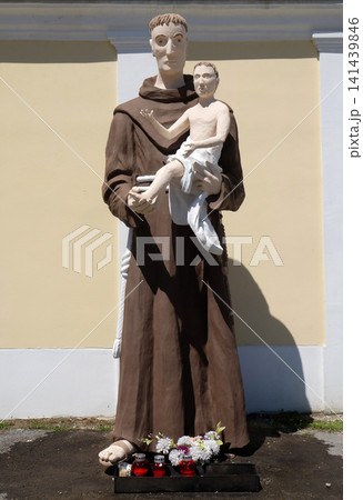 Saint Anthony of Padua statue in front of Parish Church of Saint Nicholas in Hrvatska Kostajnica, Croatia Saint Anthony of Padua statue in front of Parish Church of Saint Nicholas in Hrvatska Kostajnica, Croatia 141439846