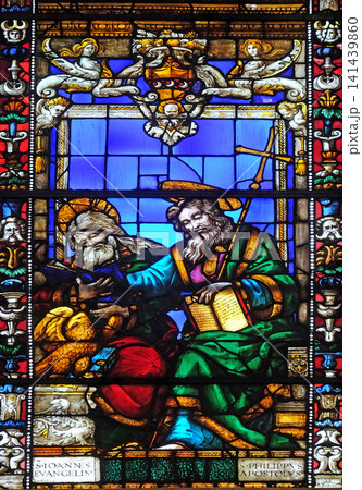 Saint John the Evangelist and Saint Philip the Apostle, stained glass window in Santa Maria Novella Principal Dominican church in Florence, Italy Saint John the Evangelist and Saint Philip the Apostle, stained glass window in Santa Maria Novella Principal Dominican church in Florence, Italy 141439860