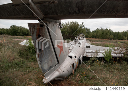 Abandoned Trainer Aero Jet in Grassy Airfield Abandoned Trainer Aero Jet in Grassy Airfield 141440339