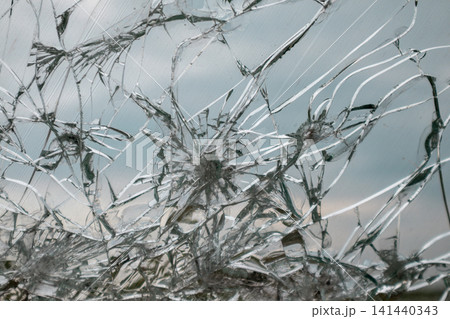 Shattered Car Window with Cracked Glass Pattern 141440343