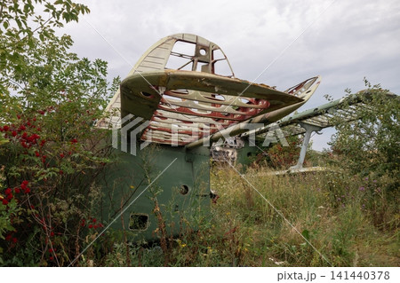 Abandoned An-2 airplane rusting in summer airfield Abandoned An-2 airplane rusting in summer airfield 141440378