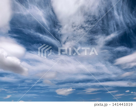 Layered Cirrus Clouds in Vibrant Blue Sky Layered Cirrus Clouds in Vibrant Blue Sky 141441019
