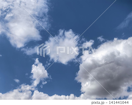 Blue Sky with Large White Cumulus Clouds and Open Copy Space Blue Sky with Large White Cumulus Clouds and Open Copy Space 141441044