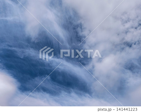 Dramatic Layered Clouds Over Open Blue Horizon Dramatic Layered Clouds Over Open Blue Horizon 141441223