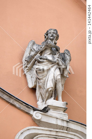 Angel on the portal of Dreifaltigkeitskirche ( Holy Trinity ) church in Graz, Styria, Austria Angel on the portal of Dreifaltigkeitskirche ( Holy Trinity ) church in Graz, Styria, Austria 141442464