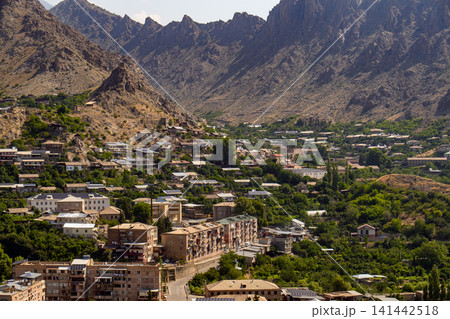 Scenic overlook of a town in mountainous terrain Scenic overlook of a town in mountainous terrain 141442518