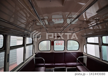 Detail of the interior of a vintage bus. Retro bus. Close-up of the armrest, insides of the bus. Interior of a classic vintage bus Detail of the interior of a vintage bus. Retro bus. Close-up of the armrest, insides of the bus. Interior of a classic vintage bus 141443080