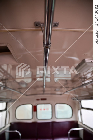 Detail of the interior of a vintage bus. Retro bus. Close-up of the armrest, insides of the bus. Interior of a classic vintage bus Detail of the interior of a vintage bus. Retro bus. Close-up of the armrest, insides of the bus. Interior of a classic vintage bus 141443082