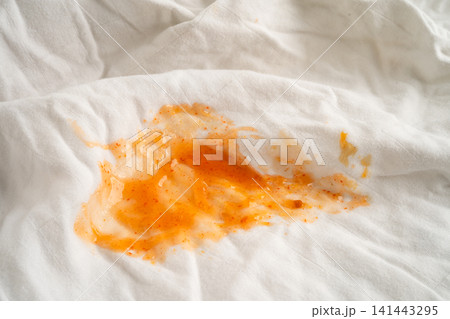 Dirty sauce stain on cloth to wash with washing powder, cleaning housework. 141443295