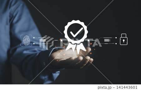 Hand holding glowing quality certification seal, fingerprint and padlock icon. Concept of identity verification, biometric security, professional trust, and digital compliance standards. Hand holding glowing quality certification seal, fingerprint and padlock icon. Concept of identity verification, biometric security, professional trust, and digital compliance standards. 141443601