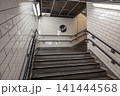 Subway station staircase with white tiled walls 141444568