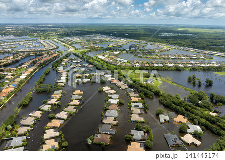 Flooded residential area with underwater houses from hurricane Debby rainfall water in Laurel Meadows community in Sarasota, Florida. Aftermath of natural disaster in southern USA Flooded residential area with underwater houses from hurricane Debby rainfall water in Laurel Meadows community in Sarasota, Florida. Aftermath of natural disaster in southern USA 141445174