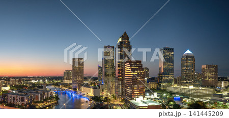 Downtown district of Tampa city in Florida, USA after sunset. Brightly illuminated high buildings in modern American urban area. Downtown district of Tampa city in Florida, USA after sunset. Brightly illuminated high buildings in modern American urban area. 141445209