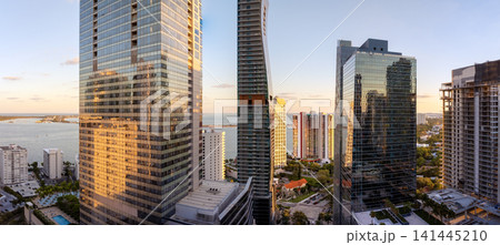 Downtown district of Miami in Florida, USA at sunset. Waterfront urban landscape of high skyscraper buildings near Biscayne Bay in modern American megapolis 141445210