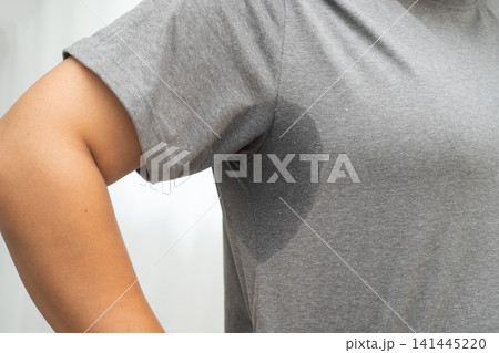 Sweaty underarms, Asian woman with sweat on clothes under armpit. 141445220
