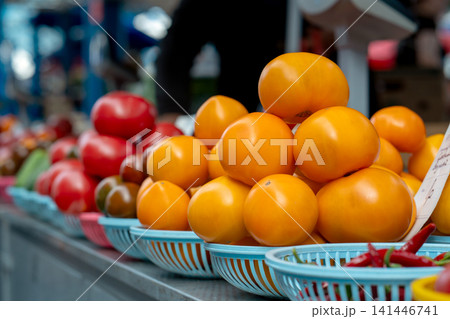 Multicolored tomatoes on a market stall. Farmers market. Multicolored tomatoes on a market stall. Farmers market. 141446741
