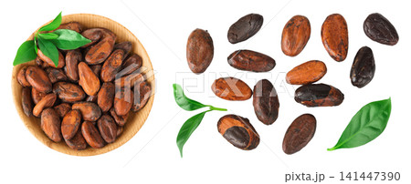 cocoa beans in wooden bowl isolated on white background. Top view. Flat lay cocoa beans in wooden bowl isolated on white background. Top view. Flat lay 141447390