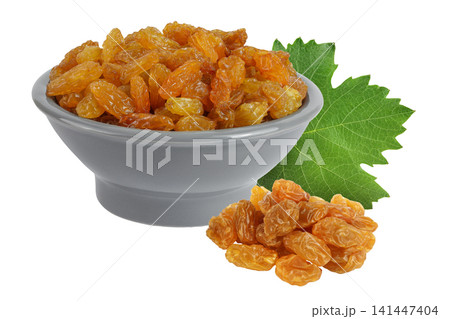 Yellow Raisins in ceramic bowl isolated on white background. 141447404