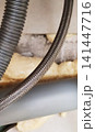 Flexible hose with a metal braided sheath. 141447716