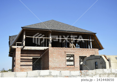 construction of a residential building. red brick walls construction of a residential building. red brick walls 141448650