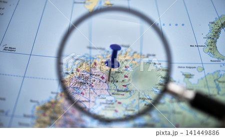 LAPPLAND highlighted on paper map with magnifying glass 141449886