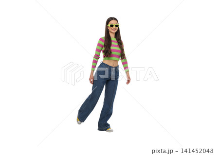 Young woman poses in trendy striped top and jeans, isolated, PNG Young woman poses in trendy striped top and jeans, isolated, PNG 141452048