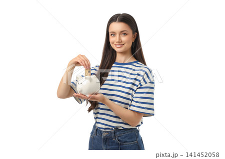 Woman holds a piggy bank and adds coins with joy, on white, PNG Woman holds a piggy bank and adds coins with joy, on white, PNG 141452058
