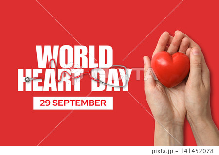 World Heart day. Hands hold a red heart with a stethoscope, symbolizing heart day 141452078