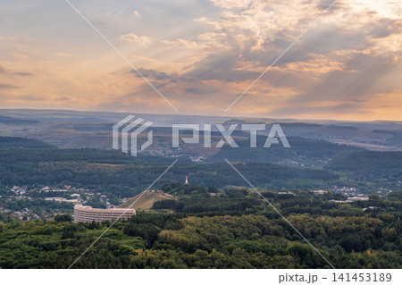 Layers of green mountains and hills in the haze during sunset. Panoramic View of Green hills and Meadow. 141453189