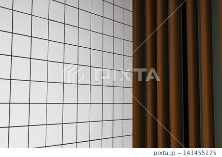 Modern Grid Tiled Wall With Vertical Wooden Slats Modern Grid Tiled Wall With Vertical Wooden Slats 141455275