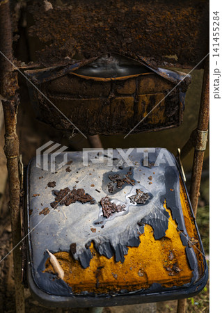 Rusty Antique Metal Chair Abandoned Outdoors In Garden Rusty Antique Metal Chair Abandoned Outdoors In Garden 141455284