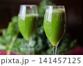 Fresh organic kale smoothie with kale leaves in background. 141457125