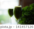 Fresh organic kale smoothie with kale leaves in background. 141457126