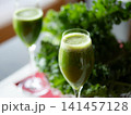 Fresh organic kale smoothie with kale leaves in background. 141457128