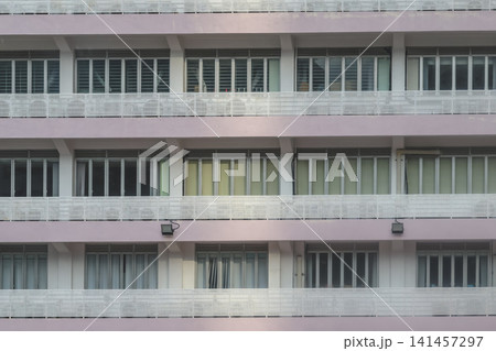 Hong Kong. July 19 2026 Lion Rock peak framed between highrise apartment buildings. 141457297