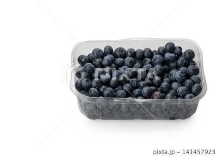 Fresh blueberries glistening in a clear container, ready to delight taste buds with their sweet and tangy flavor 141457923