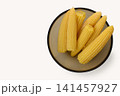 Freshly harvested sweet corn arranged neatly in a rustic bowl, ready for a delightful summer feast or a cozy family meal 141457927